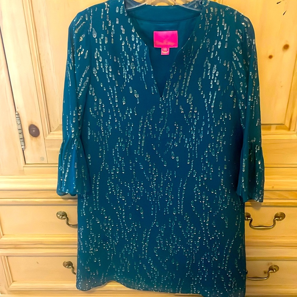 Lilly Pulitzer flutter sleeves green dress with gold detail throughout.